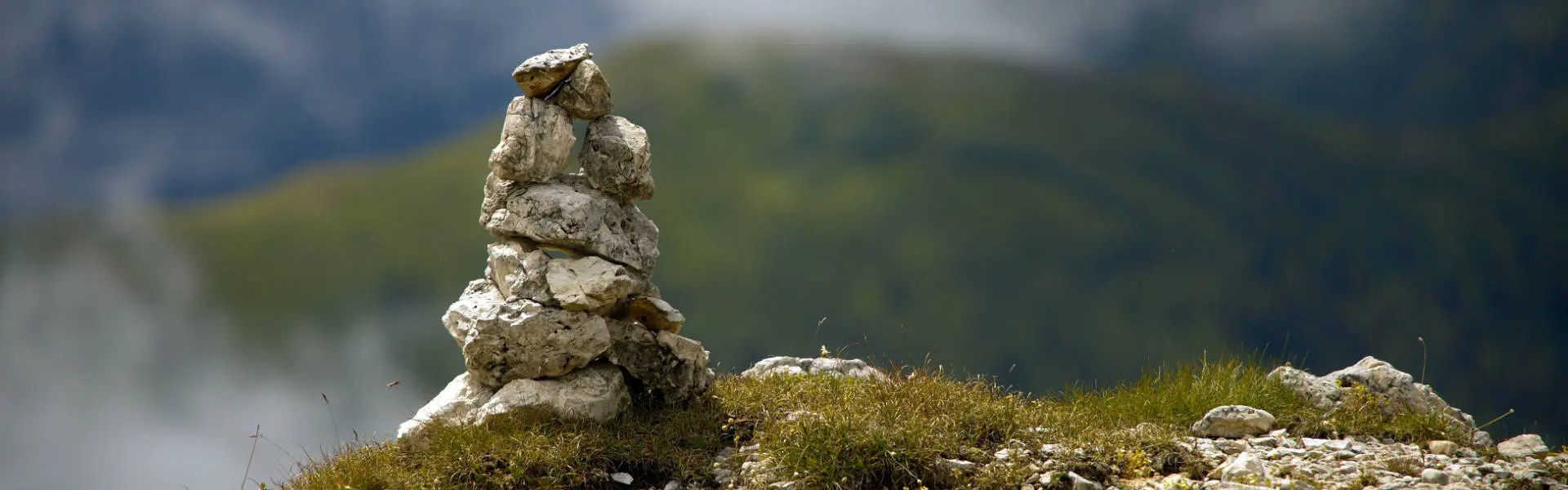 Balanced stone cairn, deliberate structure, layer by layer